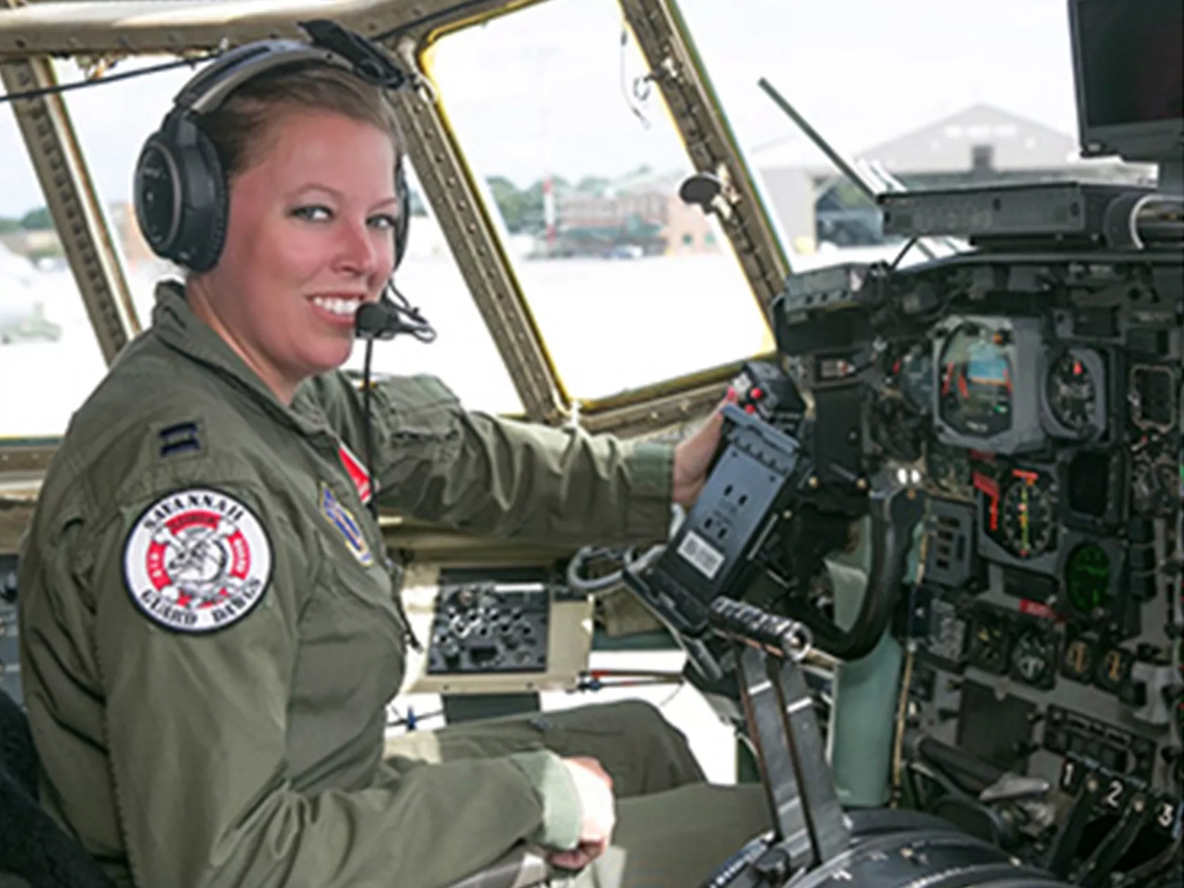 Sarah Whatson piloting a C-130 plane